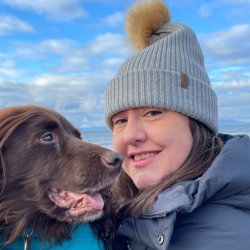 Jill McMaster with a chocolate labrador